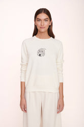 Cream sweatshirt with dog face graphic, crew neck and raglan-style sleeves