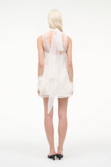 White mini dress back view with feather trim and sheer yoke