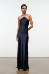 Navy halter maxi dress with beaded neckline and slim, flowing silhouette
