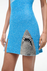 Blue sequined mini dress, square neckline, sleeveless, shark graphic at hem