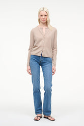 Stone cashmere cardigan worn with blue jeans