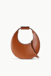 Mini moon bag tan leather with curved opening and short top handle.