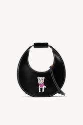 Black mini moon bag with adjustable strap and hanging dog charm