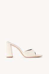 Cream open-toe heeled slide sandal with block heel