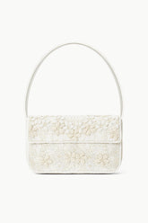 White beaded mini handbag with top handle, front flap, and zipper closure.