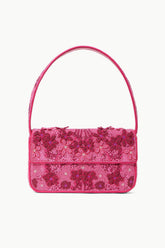 Pink beaded handbag with short top handle and flap closure, floral pattern.