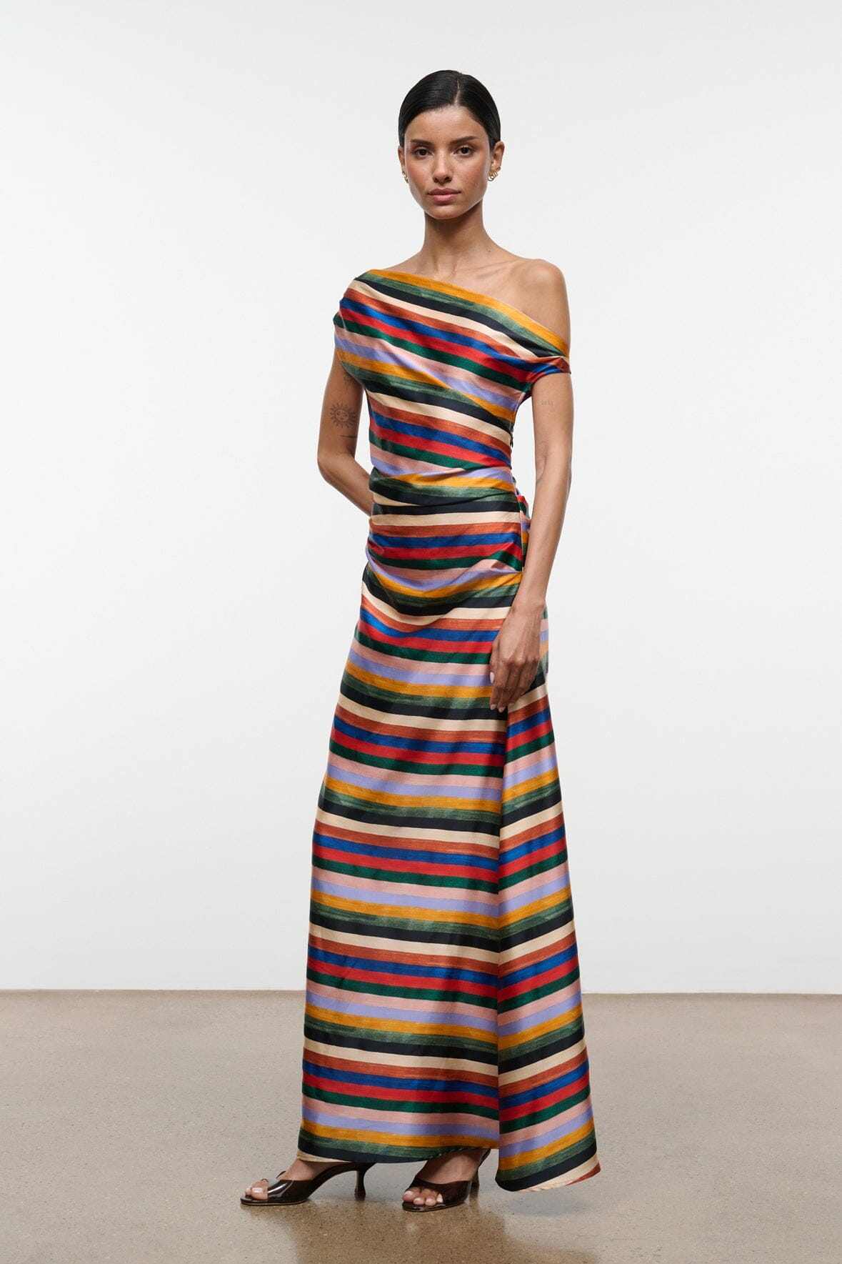 Striped silk maxi dress with off-shoulder drape, fitted waist, ankle-length hem