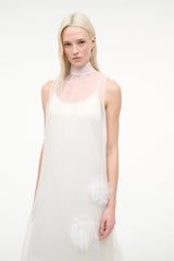 White sleeveless halter dress with feather appliques at hem and right side
