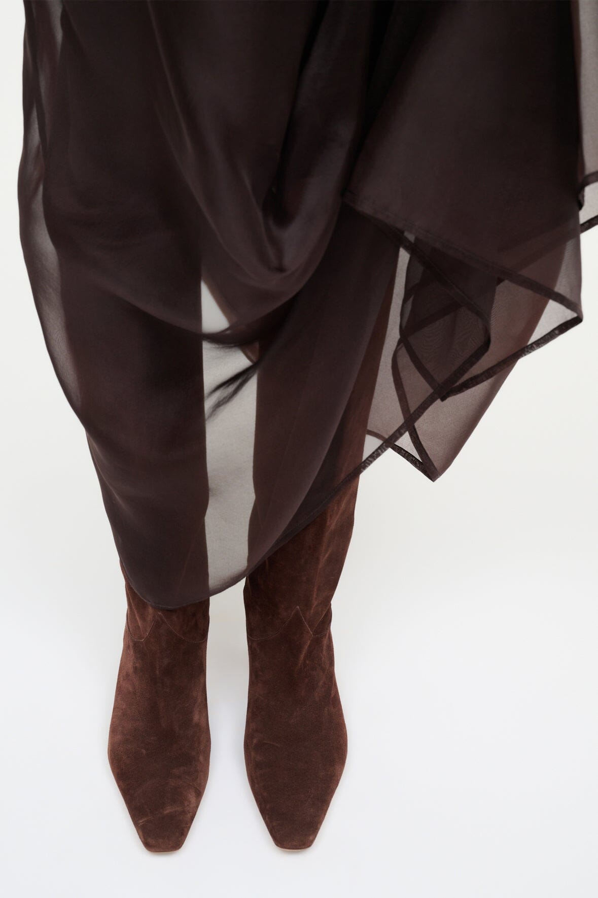 Mahogany suede boots viewed from back, pointed toe and low heel