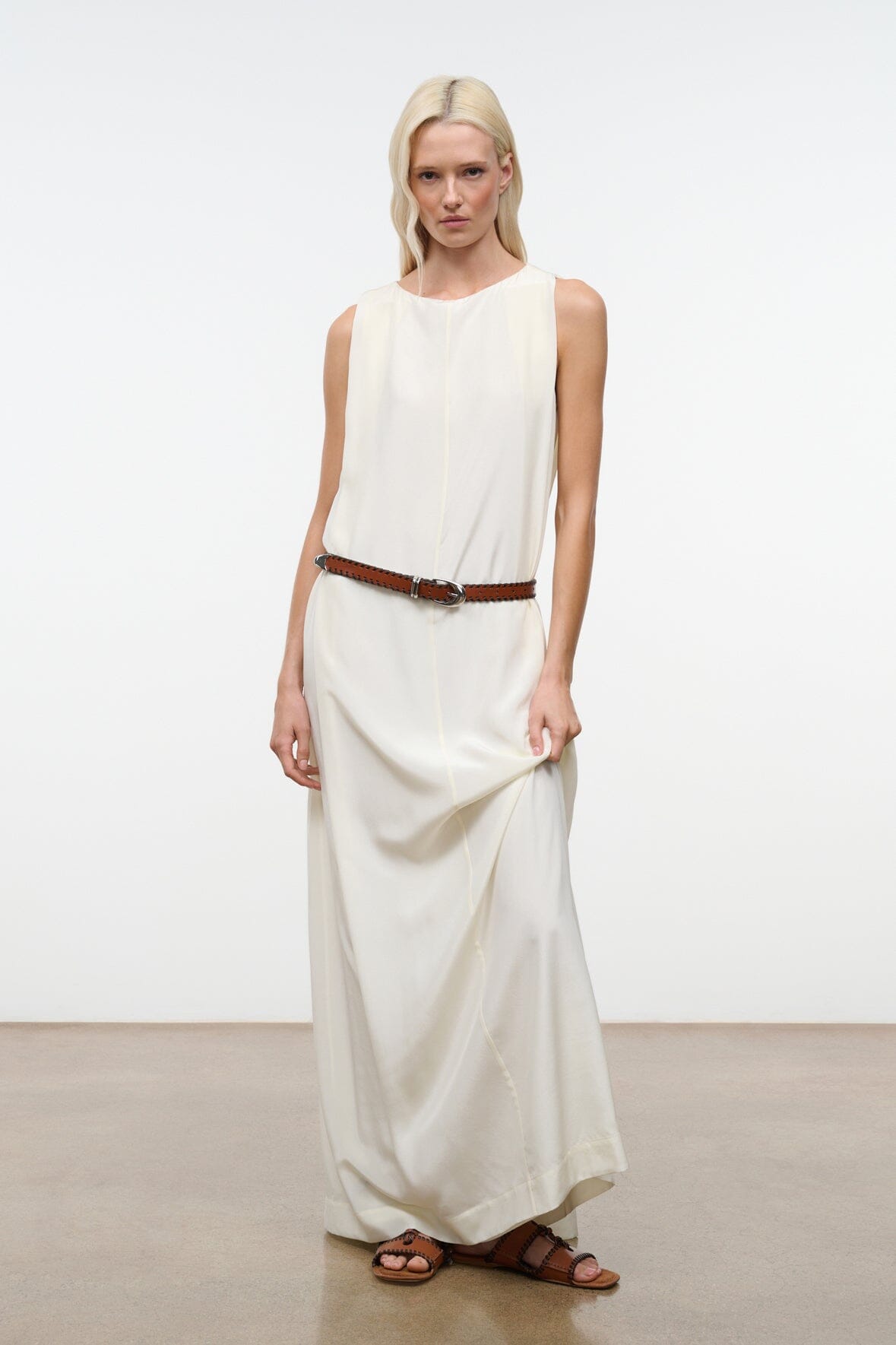 Ivory silk maxi dress with sleeveless bodice and waist belt