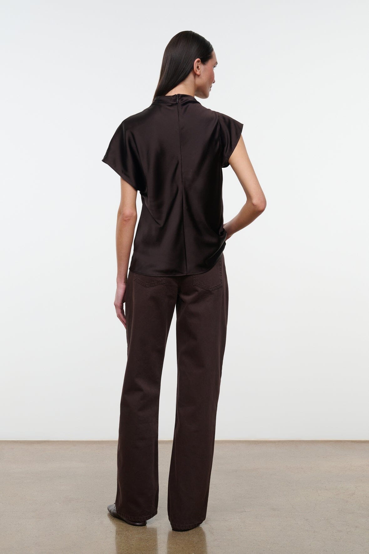 High-rise dark brown jeans, back view with yoke and back pockets
