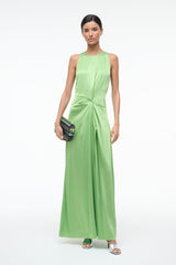 Green silk sleeveless maxi dress with gathered waist knot and flowing floor-length skirt