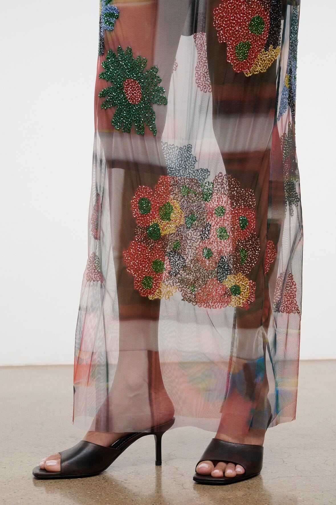 Sheer multicolor maxi skirt with beaded floral designs, visible mid-length hem