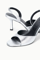 Silver heeled slingback sandal with open toe and thin high heel