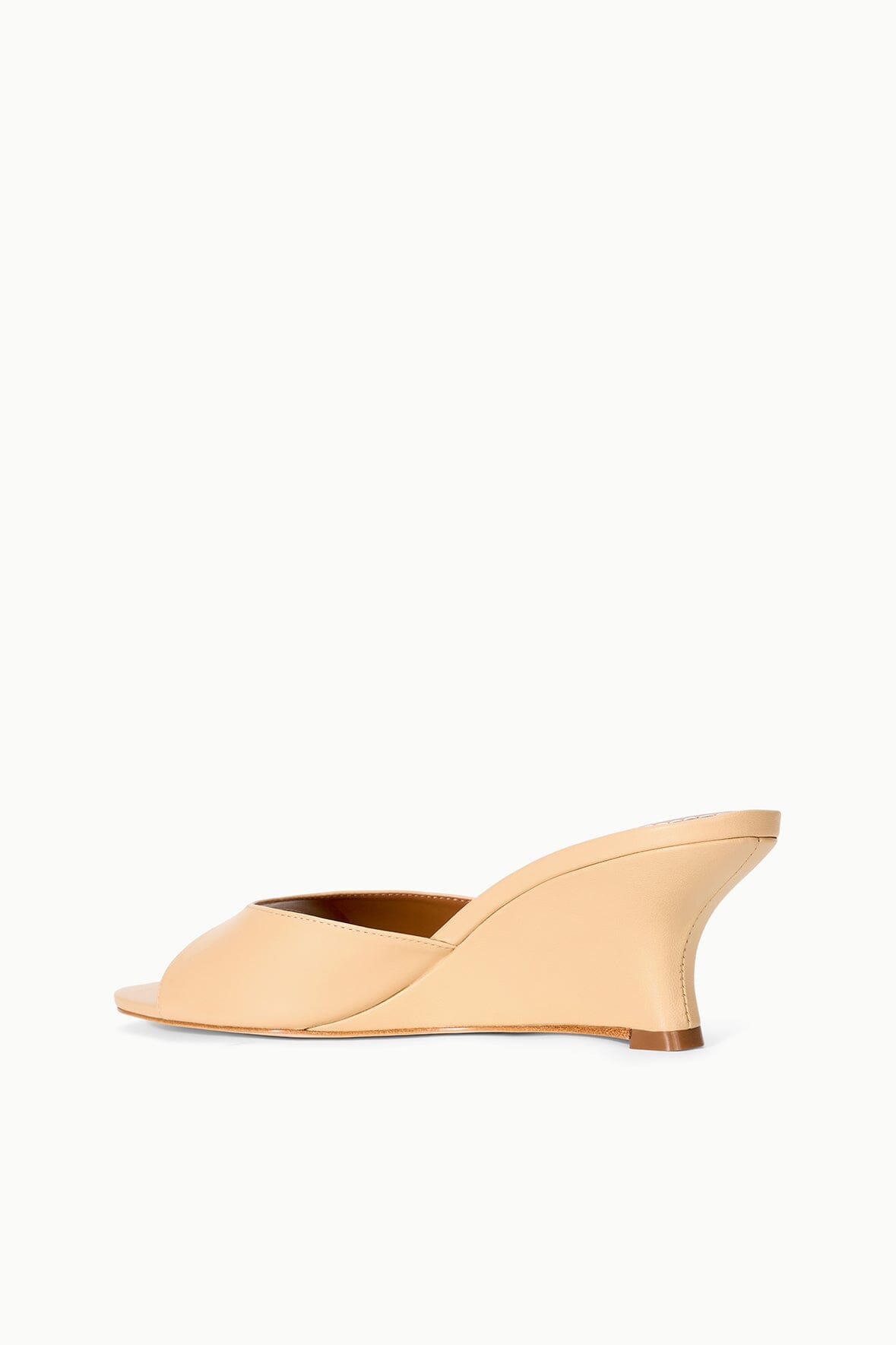 Tan wedge mules with open toe and curved wedge heel