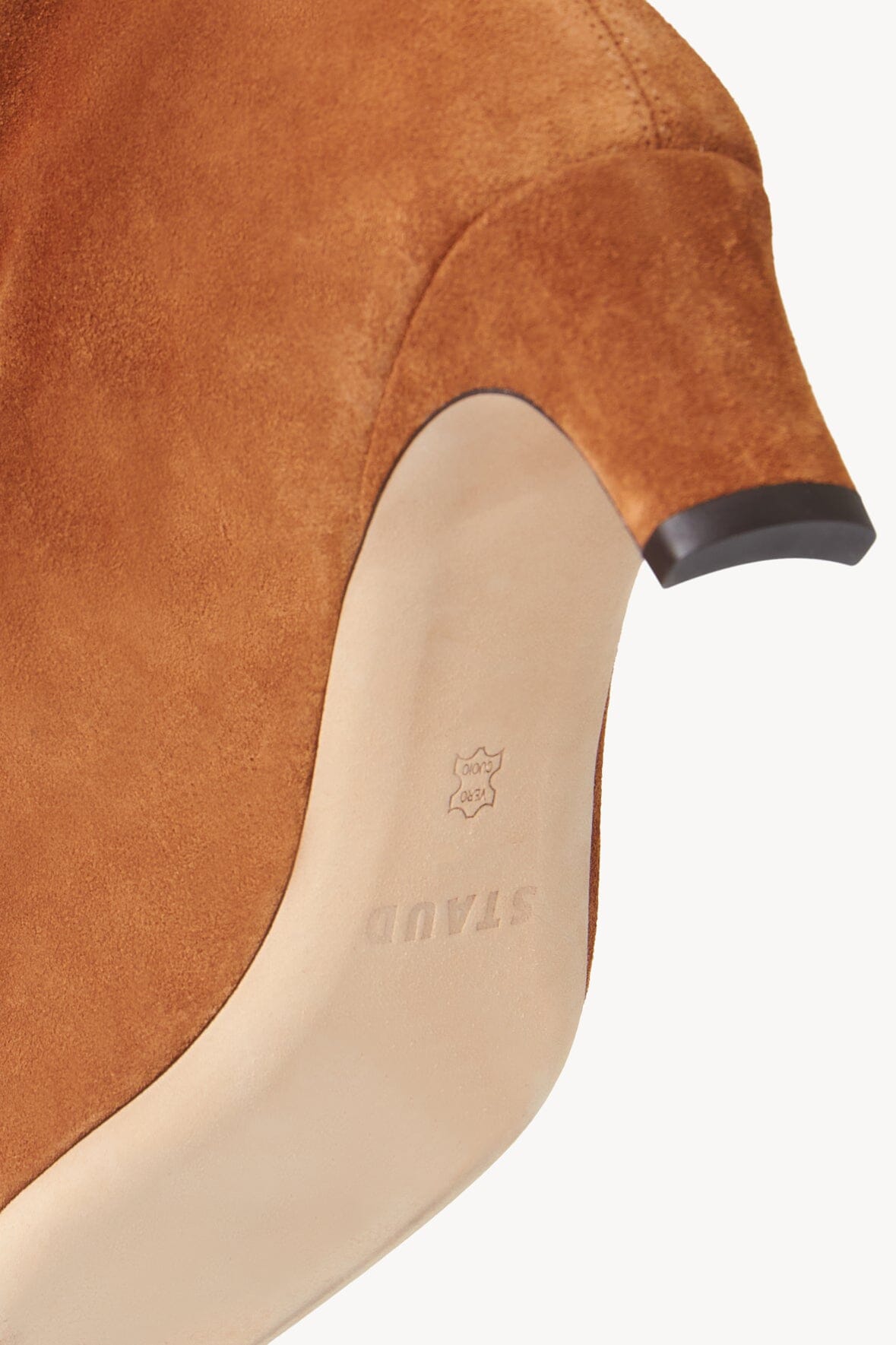 Tan suede boot lining close-up with branded insole