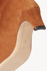 Tan suede boot lining close-up with branded insole